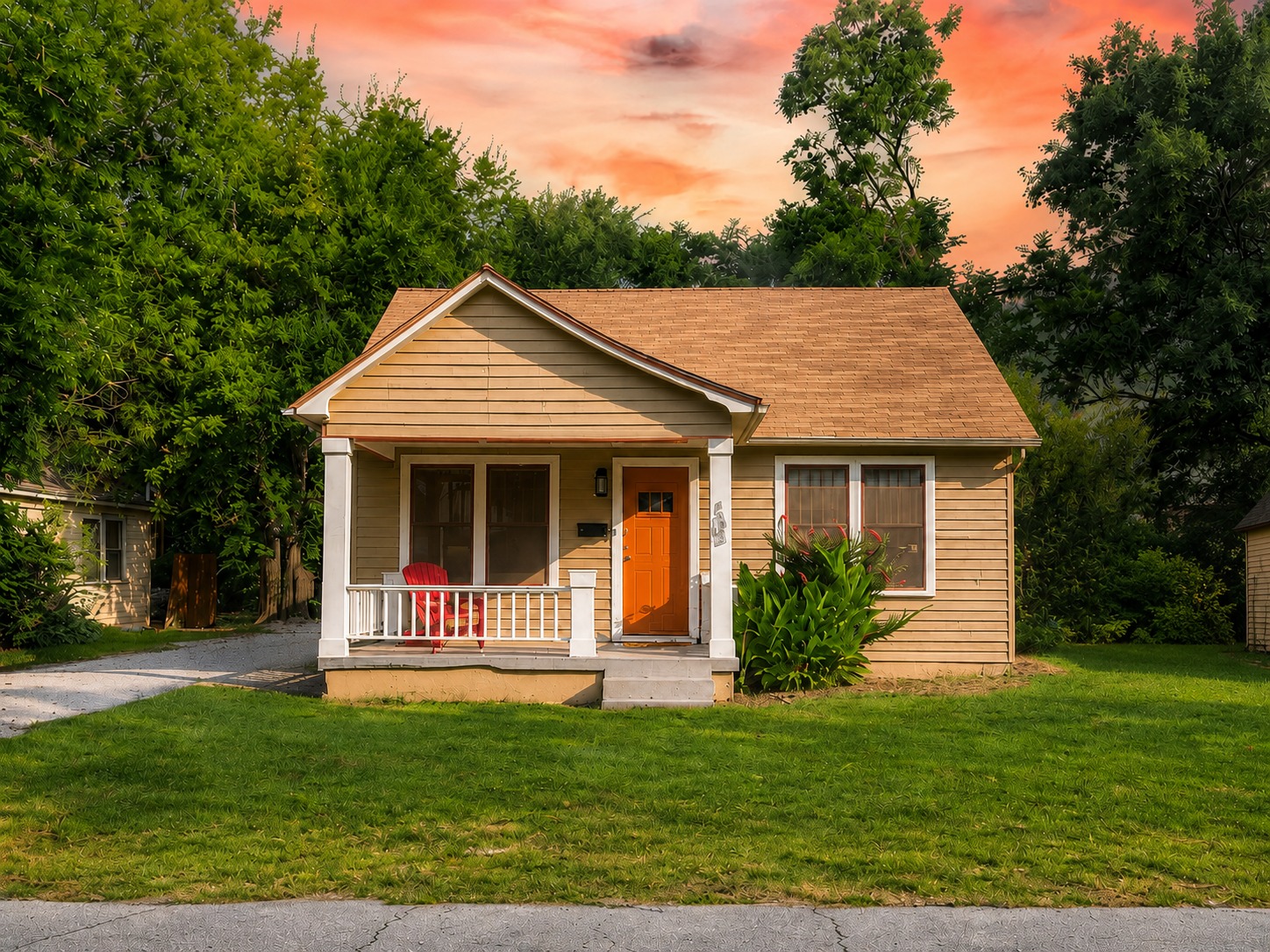 105 Maple Lane: tan cottage with an orange door, white porch, and evening sky